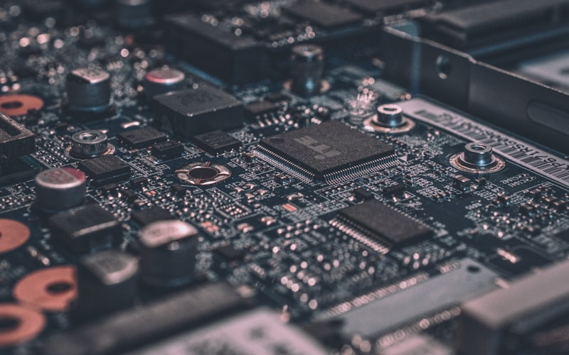 Close-up of a microchip circuit board representing our cloud and SaaS technology